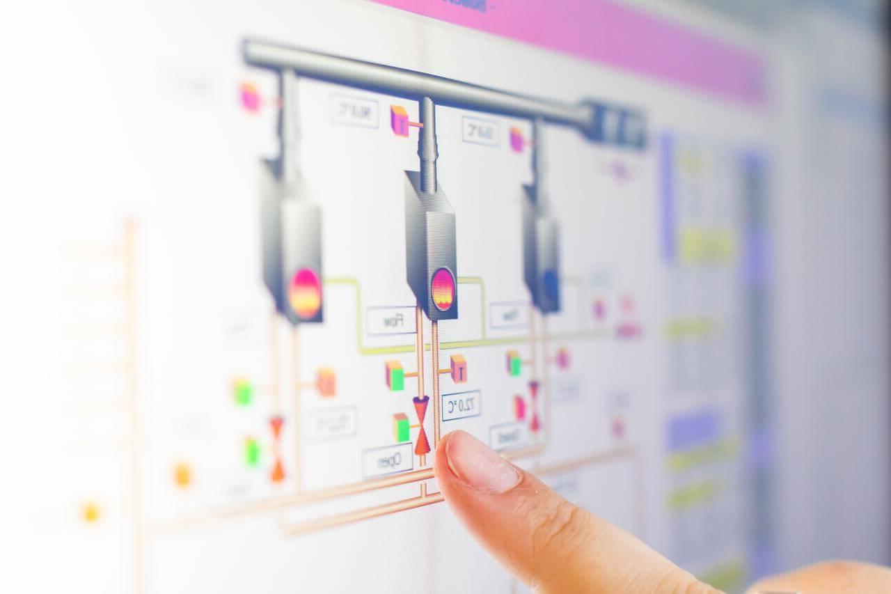 Finger pointing at digital reading for a Building Management System